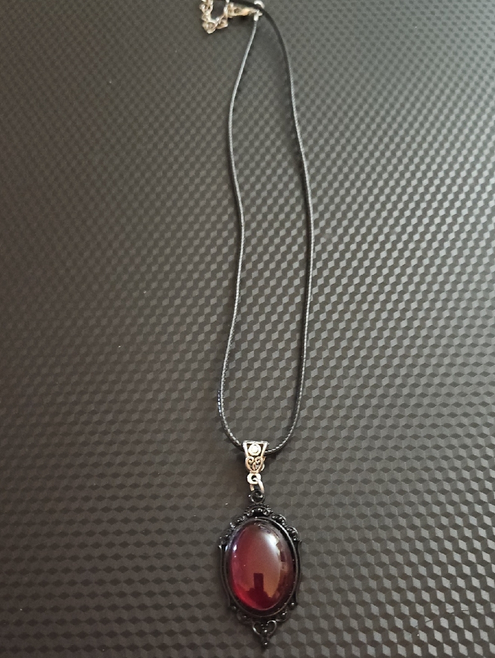 Elegant Black Pendant Necklace with Deep Red Cabochon